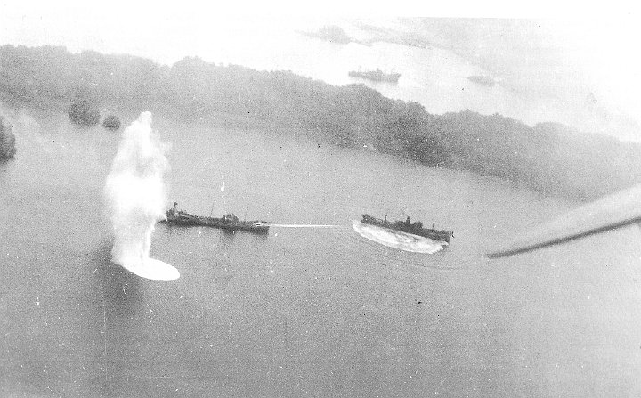 attack on palau-12.JPG - Amatsu Maru (left) and Hokutai Maru (right) are under attack. Goshu Maru (top centre) is already hit and down by the stern.